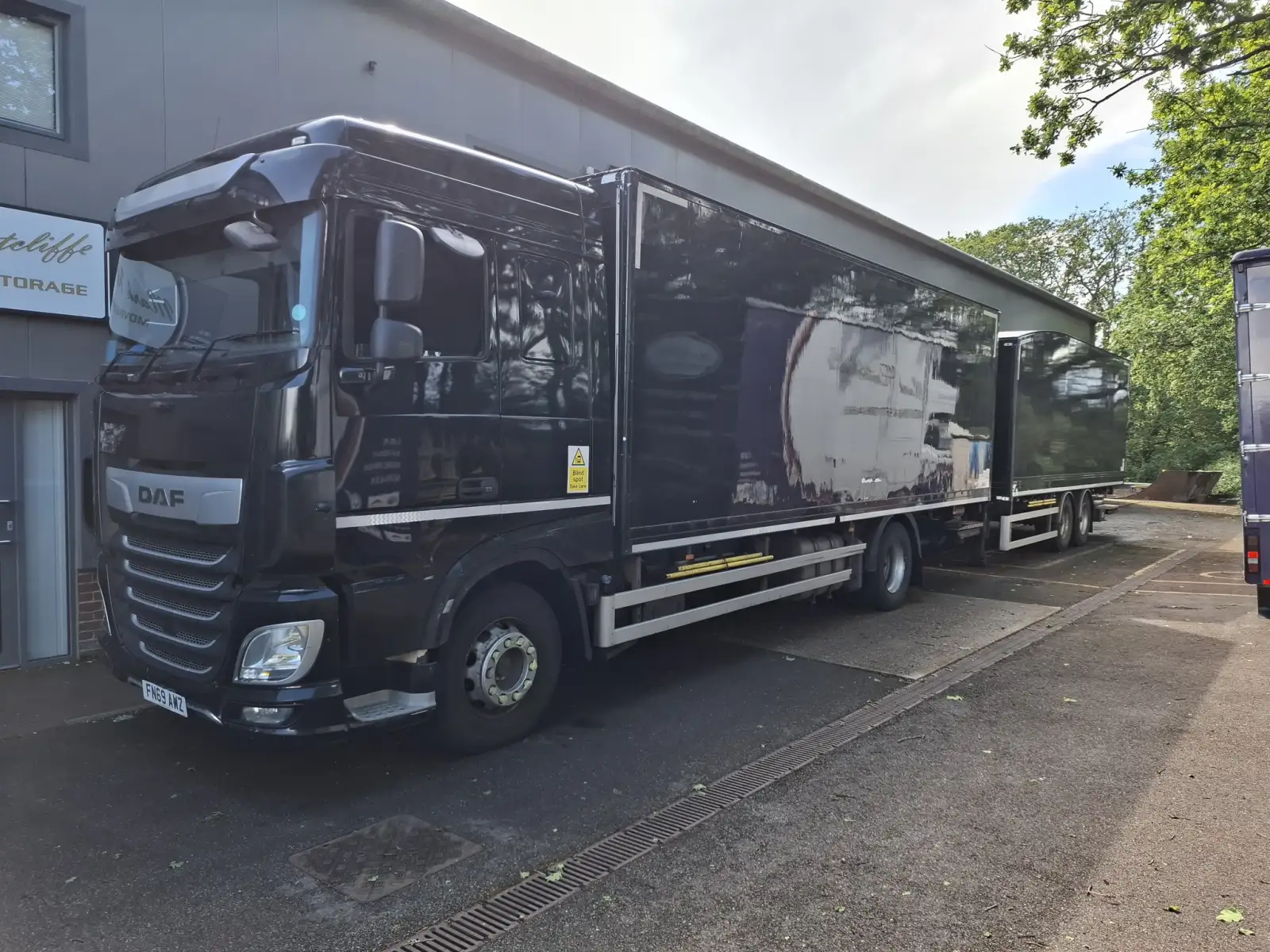 A road-train rig carrying a Mark Ratcliffe Moving removal load